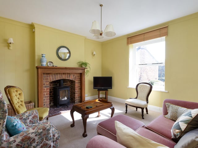 This fireplace with stove is a central feature of the room.