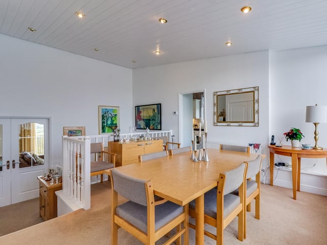 A dining area at upper level within the attractive interior.