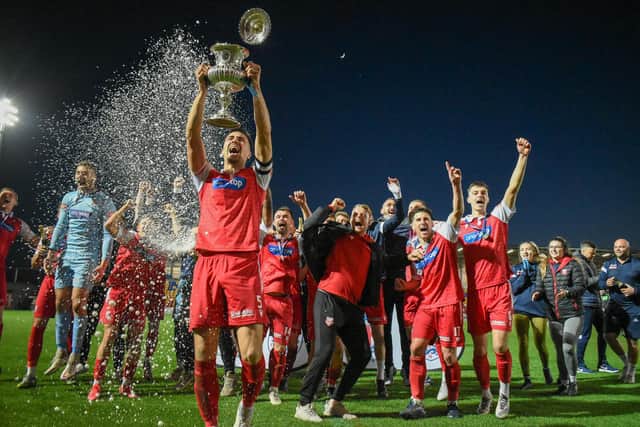 Will Thornton holds the North Riding FA Senior Cup aloft after Scarborough Athletic's 3-0 win in the final against Guisborough Town
Photo by Morgan Exley
