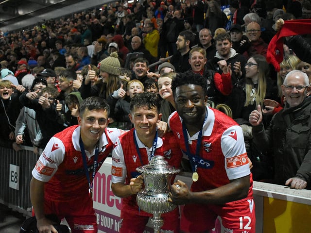 From left, players Lewis Maloney, Brad Plant and Kieran Weledji celebrate Boro winning the North Riding FA Senior Cup final
Photos by Morgan Exley