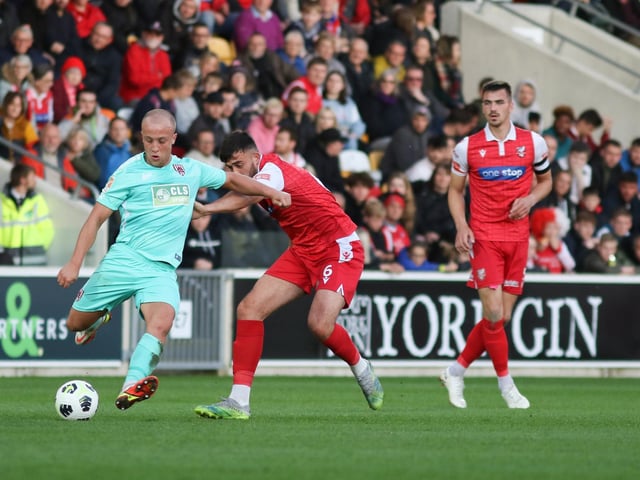 Dylan Cogill gets to grips with a Town player
