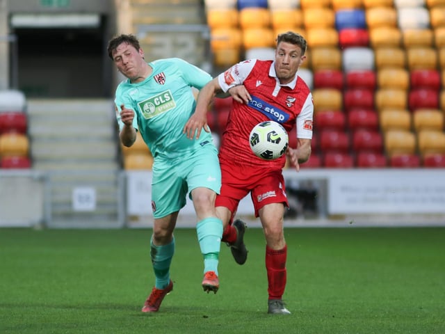Simon Heslop battles for the ball