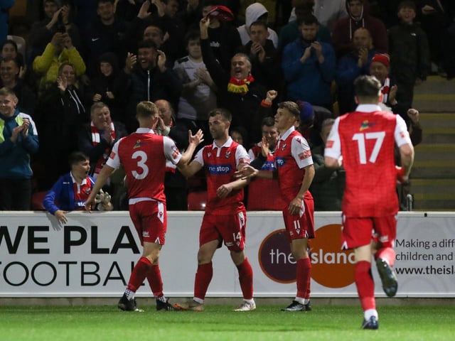 Teammates congratulate sub Ryan Watson after getting the third and final goal for Boro late on