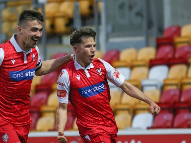 Will Thornton celebrates with opening scorer Brad Plant, right