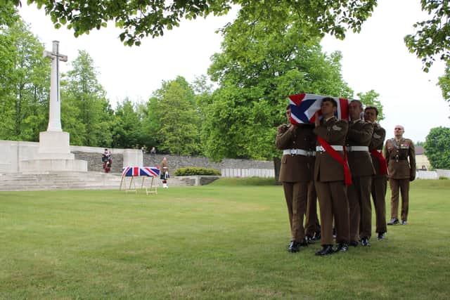 Soldiers of the Yorkshire Regiment carry the unknown soldier to his final resting place at the Commonwealth War Graves Commission’s Loos British Cemetery in northern France. Crown Copyright/A.Eden