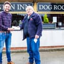 Flamborough Lifeboat operations manager David Freeman (right) receives the cheque from The Martonian's assistant manager Ross Nixon. Photo submitted