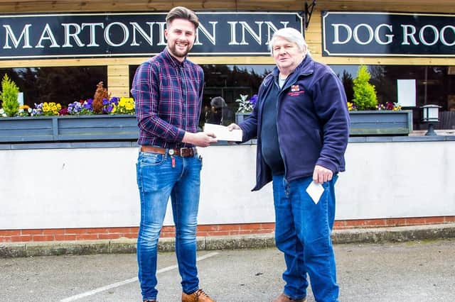 Flamborough Lifeboat operations manager David Freeman (right) receives the cheque from The Martonian's assistant manager Ross Nixon. Photo submitted