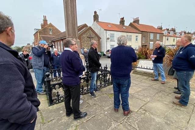 Martin Traves, Flamborough Lifeboat DLA, laid a wreath on behalf of the Flamborough Fishermen's Memorial Group and Councillor Vic Leppington a wreath on behalf of the
Flamborough Parish Council. Photo courtesy of Darren Traves