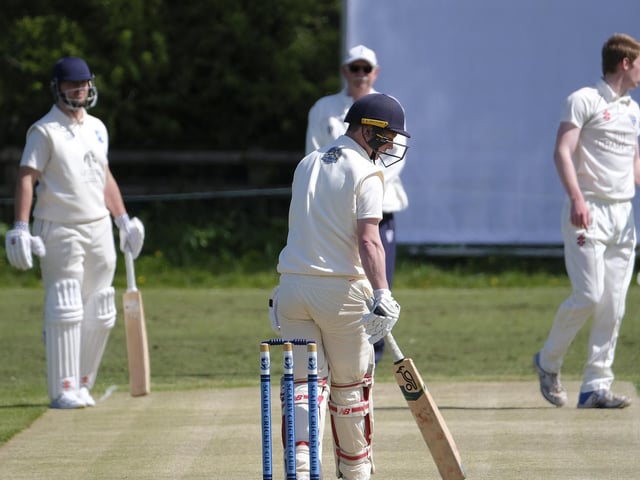 Chris Malthouse looks on after a delivery from Simpson