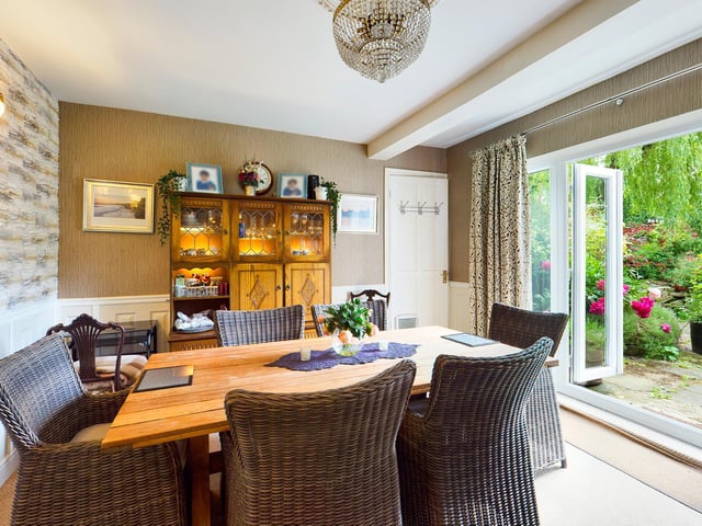 The dining room opens out to a patio and the garden, so ideal for entertaining purposes.