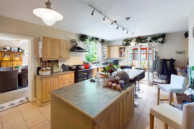 A central island is a feature of the kitchen, that oens through to the conservatory.