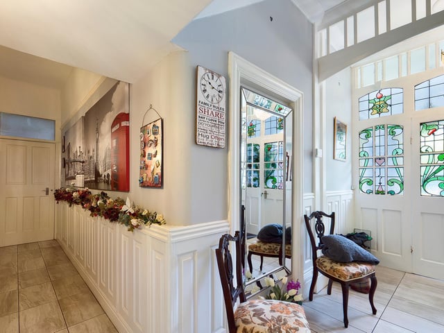 Stained glass adds colour and interest to the entrance hallway.