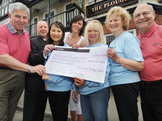 Scalby Walk cheque presentation for £3,645.50. Pictured from left, Allan Bruce, Steve Baker-Davis, Donna Wai, Tory Readman, Karen Gibson, Jacky Johnstone and Bob Gibbon.