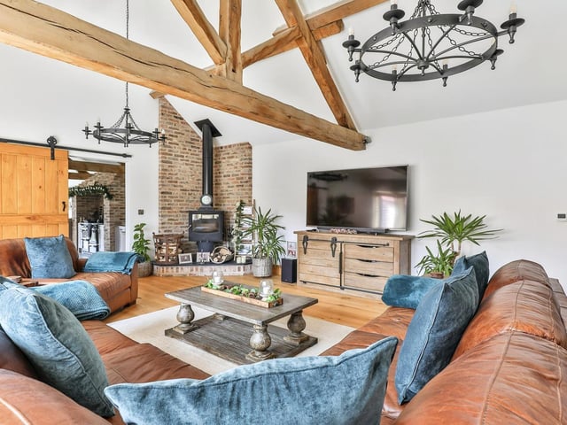 An alternative view of the lounge area, showing its stove in corner feature setting.