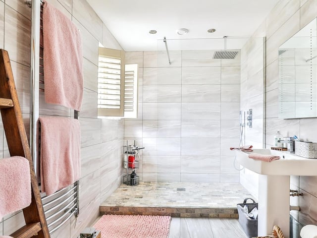 A large walk-in shower is a feature of this facility.