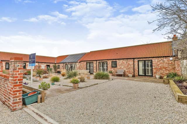 This stylish barn conversion is on th market with Reeds Rains priced at £575,000.