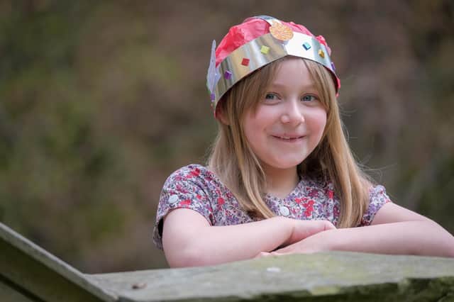 Seven-year-old Daisy Lewis wearing a Jubilee crown and you an make your own at free events