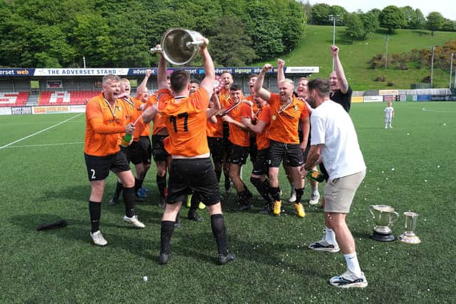 Edgehill celebrate their League Cup final win against Itis Itis Rovers
Photos by Richard Ponter