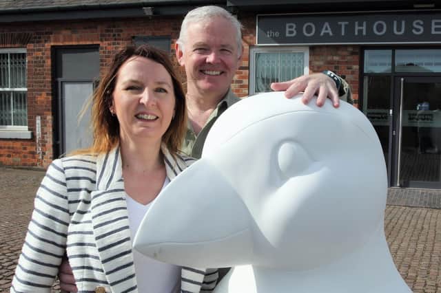 Rachel and James Murray with a fibre glass puffin outside The Boathouse offices in Hull. Photo by by Paul Smith