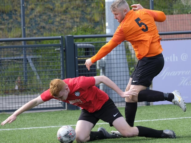 Edgehill's Sean Exley looks on as Rovers' Connor Avison goes to ground