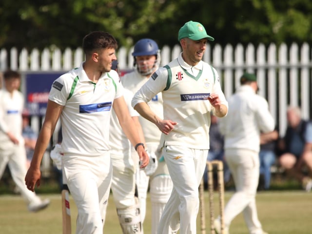 Bridlington CC fielders chat during their spell in the field against Cottingham CC