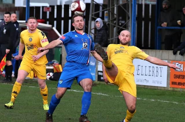 Midfielder Adam Gell, centre, has left Whitby Town