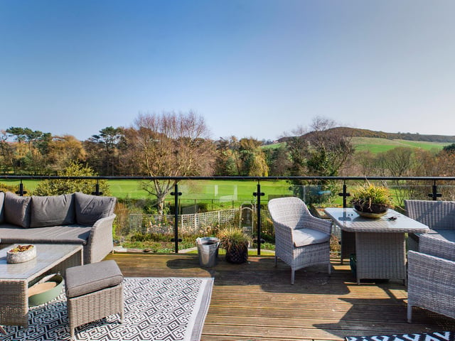 Open countryside and the South Cliff Golf Course provide panoramic views from the property.