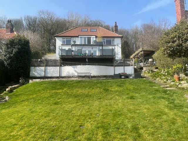 looking up towards the rear of the house from the lengthy lawned garden.