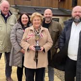 Boro chairman Trevor Bull (left) and Ant Taylor of the VBS Travel Club (right) with Jeff Barmby's daughter Debbie, wife Pat and son-in-law Mike with the new Jeff Barmby Memorial Cup.