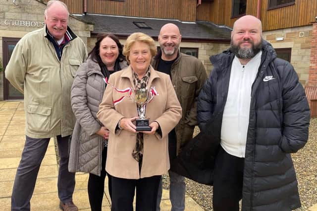 Boro chairman Trevor Bull (left) and Ant Taylor of the VBS Travel Club (right) with Jeff Barmby's daughter Debbie, wife Pat and son-in-law Mike with the new Jeff Barmby Memorial Cup.