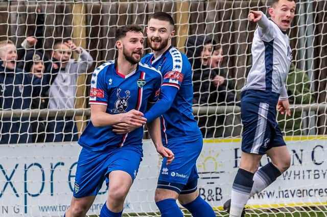 Lewis Hawkins, left, celebrates a goal with Whitby Town teammate Brad Fewster