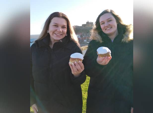 Lily and Alice Welsh enjoy a Botham's of Whitby lemon bun each.