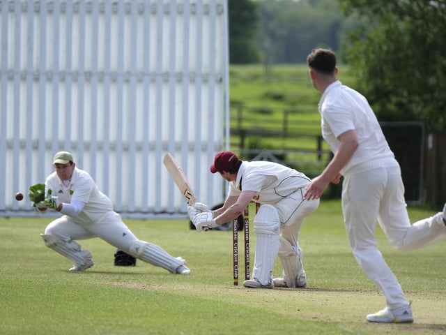 Mulgrave's wicketkeeper dives to claim the ball