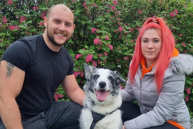 Kiba with his two owners Max Walker and Katie Burns.