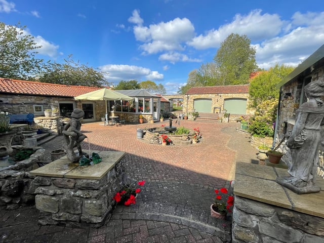 The low maintenance, stylish garden area with the property.