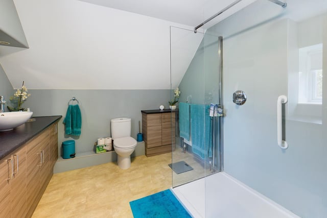 A contemporary style shower room. The property has four bathrooms all together.