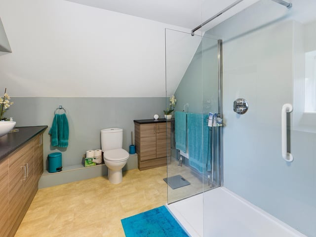 A contemporary style shower room. The property has four bathrooms all together.