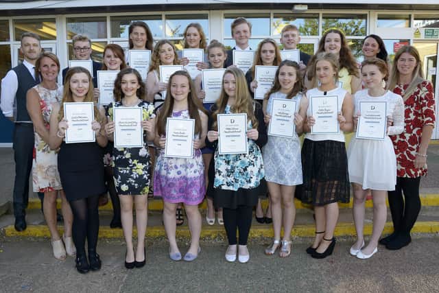 Students line up for the photographer during a presentation evening involving peer mentoring at Headlands School in 2015. (pa1527-6)