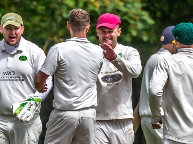 Mulgrave's Andy Raw is congratulated for his run-out of Toby Jones