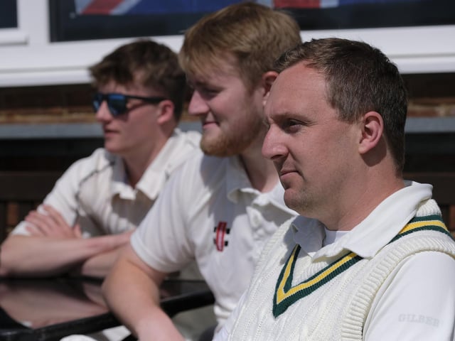 Ganton players watch their team bat at Cayton 2nds