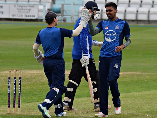 Zain Masqood and Duncan Brown celebrate an early wicket