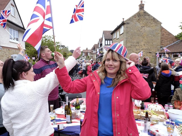 More flag waving to music provided by Coast and County Radio in Scalby.