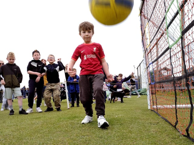 Lewis hits the back of the net at the Football Challenge at Cayton's Jubilee Fun Day.