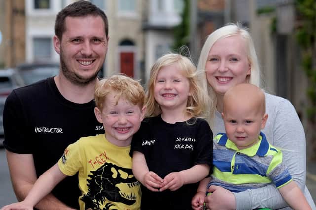 Fabian Burdett, left, and wife Holly have set up a kickboxing club dedicated to the memory of their daughter Silver Rose. They are pictured above with chilldren Beau, Leilana and Oakley 							                  

Photo by Richard Ponter