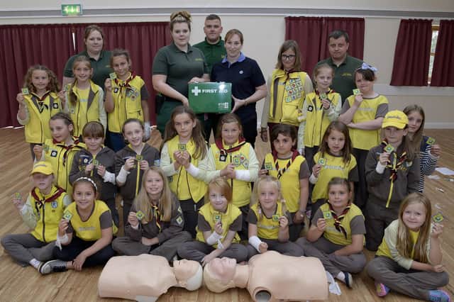Brownies pose for a picture as they learn vital skills to get their First Aid badges and certificates at Bempton Village Hall in 2015. Do you recognise any of the people in the photograph, taken by Paul Atkinson. (pa1529-4g)