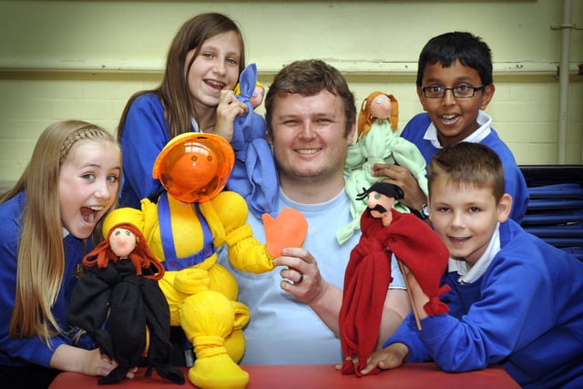 Puppeteer Lee Threadgold, centre, gives a puppet workshop to Year 6 pupils at Gladstone Road Junior School, from left, back, Gabrielle Dixon and Madhav Raj; front, Olivia Jepson and Ashley Sidebotham.