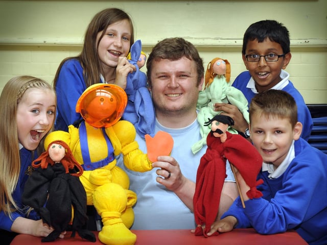 Puppeteer Lee Threadgold, centre, gives a puppet workshop to Year 6 pupils at Gladstone Road Junior School, from left, back, Gabrielle Dixon and Madhav Raj; front, Olivia Jepson and Ashley Sidebotham.