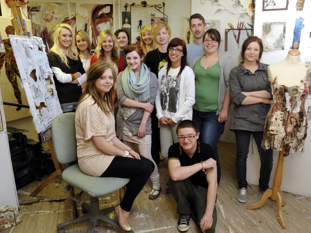Scarborough Sixth Form College A level art and textiles course show opens. The exhibiting A level students are pictured amongst work on show from the previous year's students.