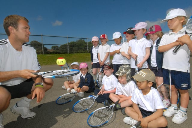 Tennis development officer Ben Atkinson takes part in a Healthy Schools day with children from St Peter's Primary School.