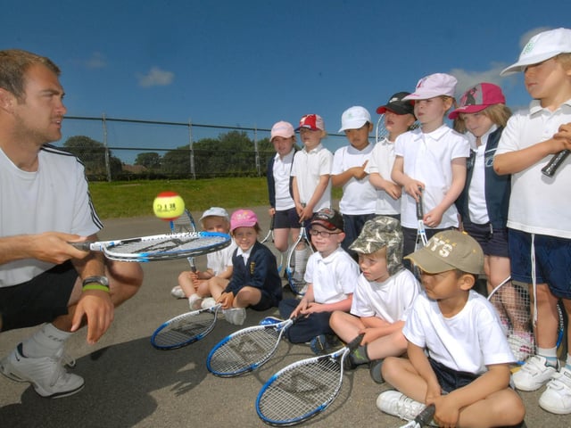Tennis development officer Ben Atkinson takes part in a Healthy Schools day with children from St Peter's Primary School.